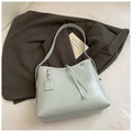 Chic light blue soft leather shoulder bag with decorative leather knot and tag - Blue Without Charm