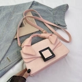 Pink snake skin patterned crossbody bag with square buckle and bow handle - Pink