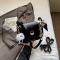 Chic black leather small square bag with silk scarf handle and plush toy charm accessory - Black