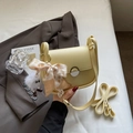 Light yellow crossbody flap bag with cherry print scarf and plush charm detail - Yellow