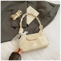 Detail of off-white baguette bag with cloud dye pattern, lace bow and braided strap - Off White