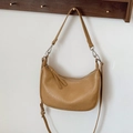 Caramel crescent-shaped crossbody bag with silver hardware and adjustable wide strap - Khaki