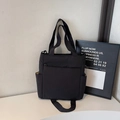 Borsa tote nera minimalista in tela ad alta capacità con tasche e tracolla regolabile - Nero