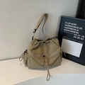 Minimalist khaki nylon crossbody bag with drawstring design and black YOU JI BEAR print - Khaki