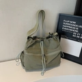 Olive green drawstring nylon crossbody bag with adjustable strap and front zipper pocket - Green