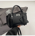 Elegant black leather tote bag with silver hardware and a mini triangle charm - Black without Pendant