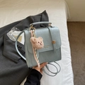 Light blue faux crocodile textured small crossbody bag with teddy bear and ribbon charm - Blue with Charm
