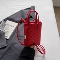 Mini red woven crossbody phone bag with top handles and silver pendant detail - Red