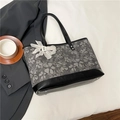 Gray floral jacquard tote bag with black leather straps and white lace flower detail - Black