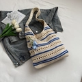 Beige and blue striped knit tote bag with floral charm on white textured background - White/Blue Stripes with Pendant