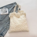 Cremefarbene Canvas-Tasche mit gelbem Blumenmuster und plissierten Rüschendetails - Cremeweiß