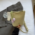 Pale green woven bucket bag with purple tulip charms and woven strap detail - Yellow