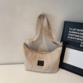 Minimalist beige crescent shoulder bag with Keep Going label and adjustable strap - Off White