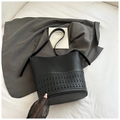 Fashionable black laser-cut bucket bag with geometric patterns and adjustable strap - Black