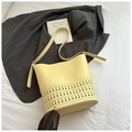 Chic laser-cut hollow bucket bag in bright yellow with matching inner pouch and strap - Yellow