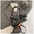 Elegante borsa a cuscino a pois neri con doppio fiocco e tracolla rimovibile sottile - Nero