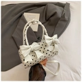 Borsa a cilindro a pois bianchi in pelle verniciata con eleganti doppi fiocchi - Bianco