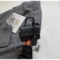 Detailed close-up of black crossbody bag featuring mixed textures and silver metal chain - Black Small