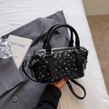 Black quilted mini Boston bag with silver studs and adjustable crossbody strap - Black