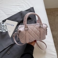 Pink quilted Boston handbag with sparkling rhinestones and silver hardware on a blazer - Pink