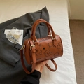 Brown Boston cylinder handbag with cartoon animal prints and adjustable shoulder strap - Brown