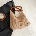 Detailed macro view of woven beige texture and brown leather strap with metal buckle - Khaki