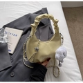 Detail of yellow pleated leather cloud bag with metal chain strap and plush charm - Yellow with Cloud Pendant