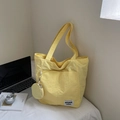 Waterproof yellow nylon tote bag with small round coin pouch and exterior pocket - Yellow