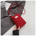 Detail of red PU phone bag with pearl strap, bow logo and heart-shaped charms - Red