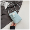 Detail of light blue PU leather phone bag with elegant pearl and woven strap accents - Blue