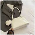 Detail of creamy white leather shoulder bag with matching heart-shaped coin purse accessory - With Ornament / White