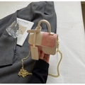 Detail of a mini two-tone crossbody bag with pink suede panels and a gold chain strap - White/Pink Small