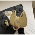Minimalist beige hobo bag with pleated texture and metal clasp closure on grey blazer - No Pendant / Yellow