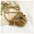 Detailansicht der Boho-Webtasche mit bunten Quasten, Perlen und Blumenstickerei - Khaki