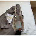 Silver marble pattern tote bag with woven charm and adjustable crossbody strap - Silver With Pendant