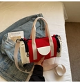 Detail of red and white canvas Boston bag with side pocket and YOU JI BEAR logo tag - Red