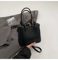 Minimalist black bucket handbag with litchi texture and unique knotted handle detail - No Pendant / Black