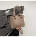 Minimalist beige lychee texture bucket bag with unique knotted handle for daily style - No Pendant / Apricot