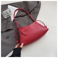 Detail of red woven shoulder bag texture with fringe tassel and leather-like finish - Red