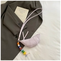 Close-up of purple croissant bag with colorful alphabet beads on grey suit jacket - Light Purple with Charm