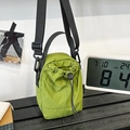 Grass green nylon drawstring bucket bag with adjustable black shoulder strap - Green
