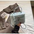 Light blue lychee texture crossbody box bag with silver zippers and a top handle - Blue