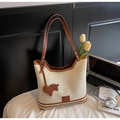 Knitted hollow tote bag with brown leather straps and a horse charm in cream and brown - White & Coffee