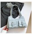 Light blue minimalist shoulder bag featuring double cargo pockets and silver buckles - Blue