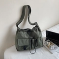 Detail of army green nylon shoulder bag with drawstring closure and utility cargo pockets - Green