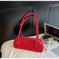 Minimalist red leather Boston shoulder bag with slim cylindrical shape and long straps - Burgundy