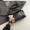 Glossy black rectangular shoulder bag with a cute bear charm and embossed logo - Black With Pendant