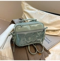 Detail of mint green PVC jelly bag with shiny patent leather finish and dual zippers - Green