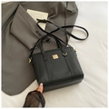 Minimalist black lychee pattern leather bucket bag with gold hardware and shoulder strap - Black