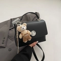 Matte black leather flap handbag with silver metal lock and cute plush bear charm accessory - With Pendant / Black